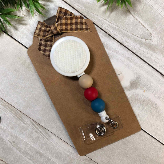 Interchangeable badge reel with silicone beads