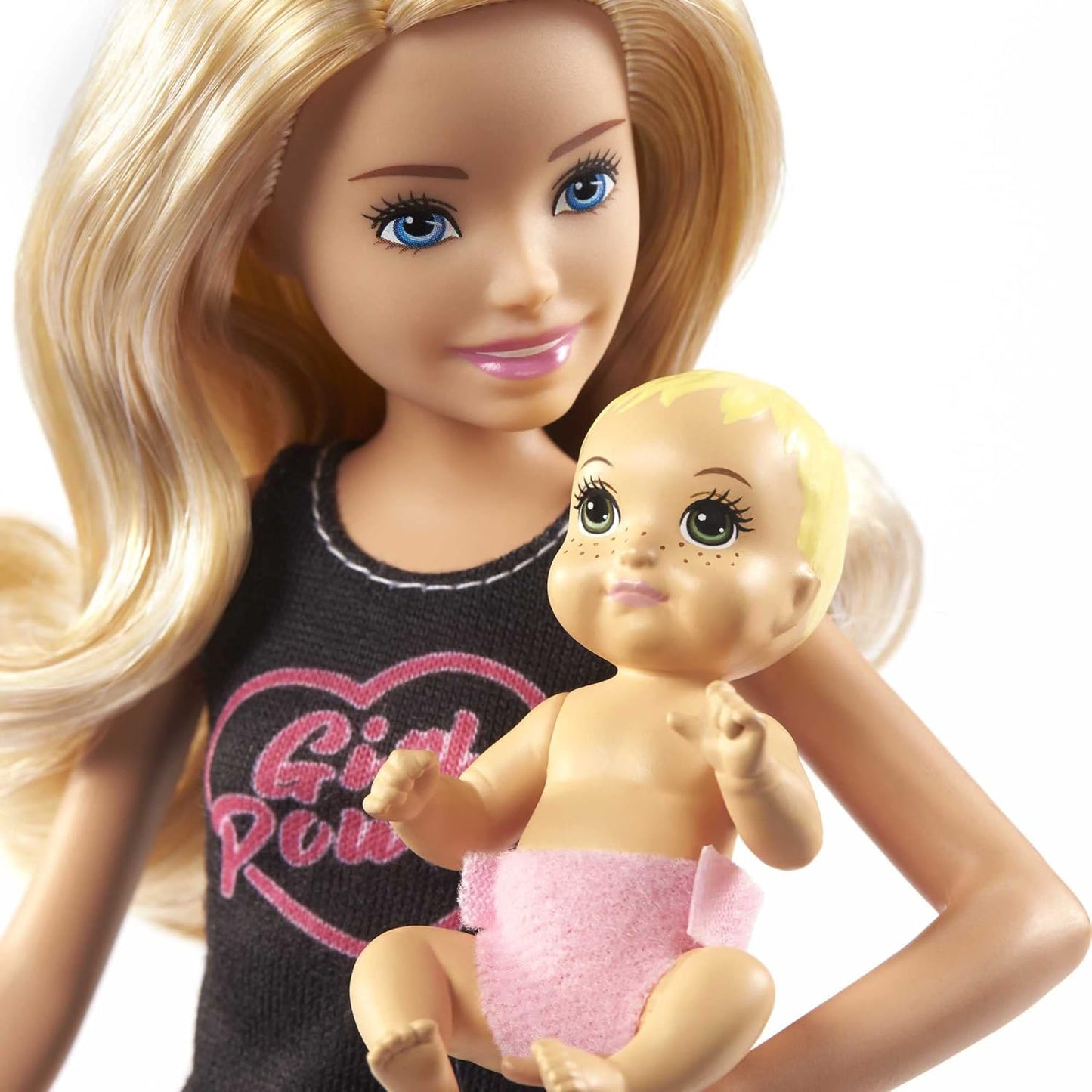 Barbie doll holding a baby doll with a white background