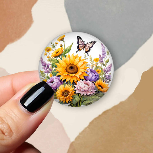 Badge topper with a butterfly and sunflowers in gold and lilac for interchangeable badge reels